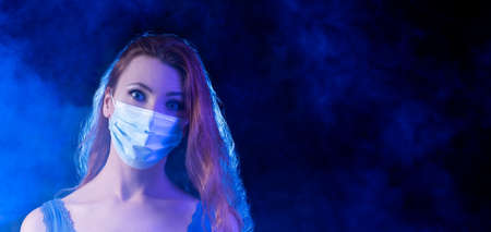 Woman wearing a safety mask and looking scared.
