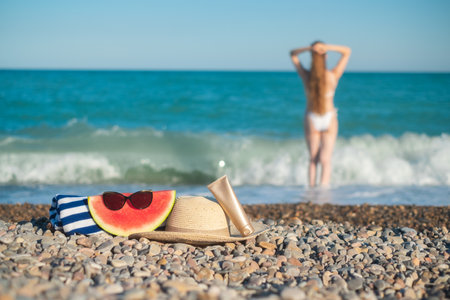 Tall woman with a long hair from a back is on a beach.の写真素材