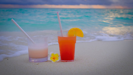 Close up of hands with cocktails making a toast.の写真素材
