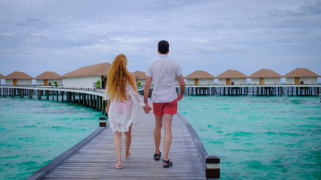 Couple is walking and holding hands. Summer travel vacation concept.の写真素材