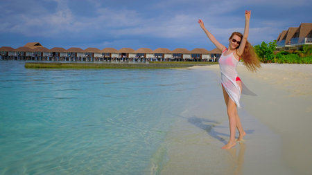 Woman in a bikini is happy. Female is happy on Maldives.の写真素材
