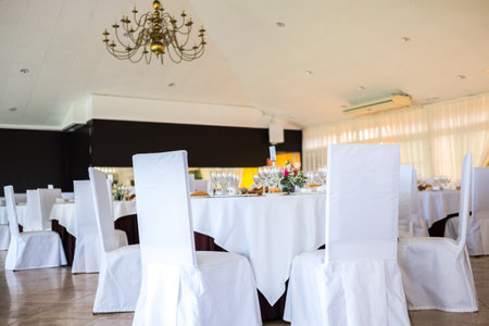 Wedding reception photo. Glasses and flowers on tables.の写真素材