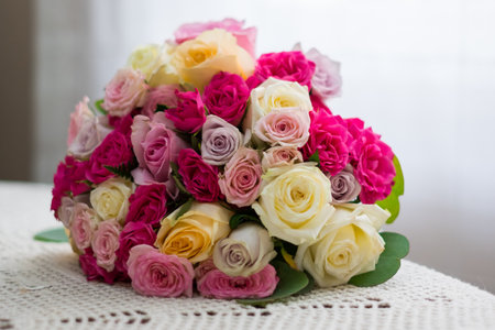 Close up of a beautiful wedding bouquet with yellow, white roses.の写真素材