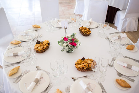 Wedding reception photo. Glasses and flowers on tables.の写真素材