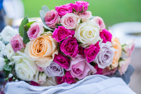 Close up of a beautiful wedding bouquet with yellow, white roses.の写真素材