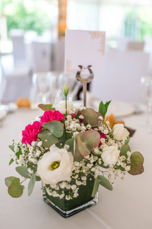 Wedding reception photo. Glasses and flowers on tables.の写真素材