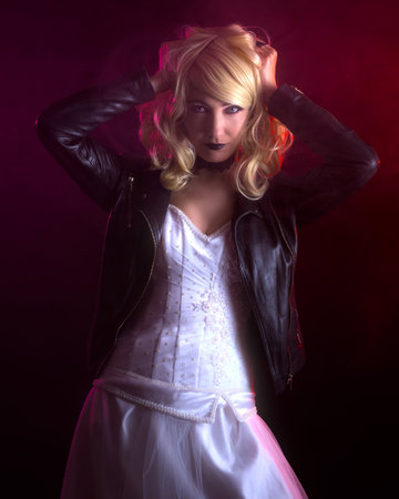 Scary woman in a wedding dress and a leather jacket.の写真素材