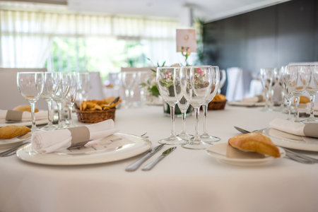 Wedding reception photo. Glasses and flowers on tables.の写真素材