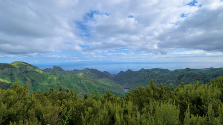 Beautiful green landscape with mountain and clouds.の写真素材