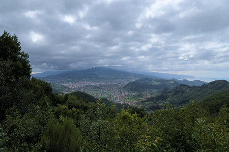Beautiful green landscape with mountain and clouds.の写真素材