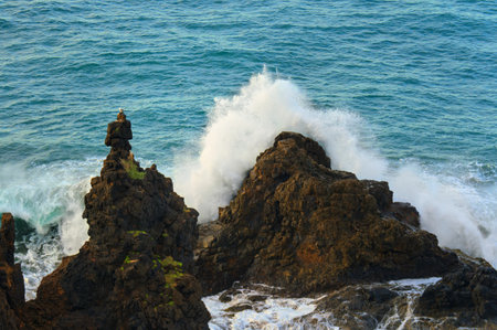 Beautiful rocks at seaside. Beautiful nature background. Mountains and waves.の写真素材