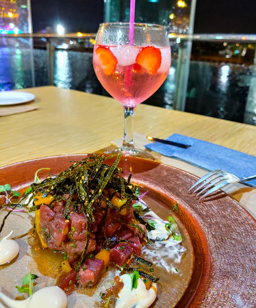 Close up of tartar with a raw tuna fish, mango, seaweed and sesame seeds.の写真素材