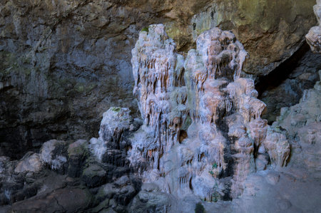 Natural cave formation with intricate stalactites and stalagmites.の写真素材