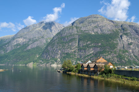 Peaceful fjord landscape in Norway, featuring towering green mountains.の写真素材