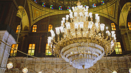 Beautiful golden chandelier inside an Egyptian mosque, showcasing intricate design and stunning...