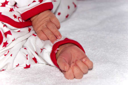 Newborn baby's pen close-up on white background.の写真素材