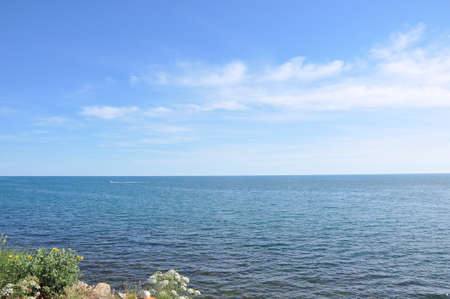 Blue sea and clouds on sky.