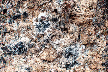 Burnt coal in the grill. Coal texture or background in grunge style. Close up.