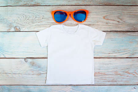 Kids t-shirt Mockup with sunglasses. Stock photo.の写真素材