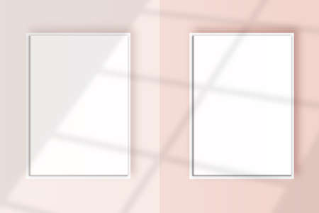 Image of a two vertical white frame mockup on a light pink wall blank mockup templateの写真素材