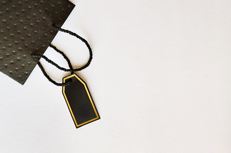 Black bag on a white background with space for textの写真素材