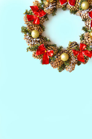 Christmas wreath on a blue background. Top view, space for text.の写真素材
