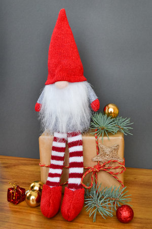 Christmas or New Year composition with a gnome, elf on a gray backgroundの写真素材