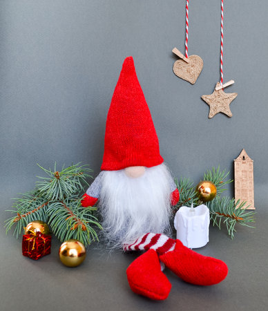 Christmas or New Year composition with a gnome, elf on a gray backgroundの写真素材