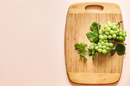 Green grapes on a wooden board, composition, space for textの写真素材