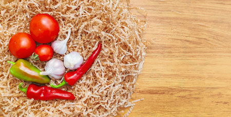 Composition of fresh vegetables on a wooden surfaceの写真素材