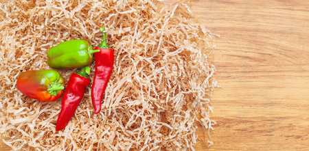 Composition of pepper, chili on gray background, top view with space for text