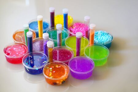 Defocused colorful slimes inside plastic boxes.の写真素材