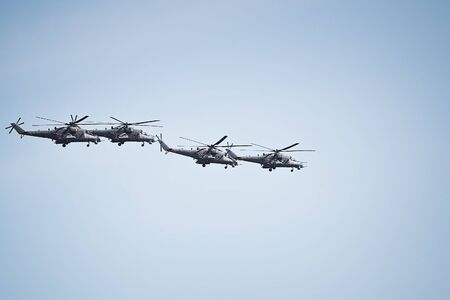 Fighters, flying helicopters at The Victory Day military parade.