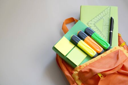 Backpack with school supplies spilling out. Back to School concept.の写真素材