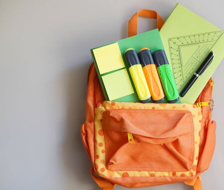 Backpack with school supplies spilling out. Back to School concept.の写真素材