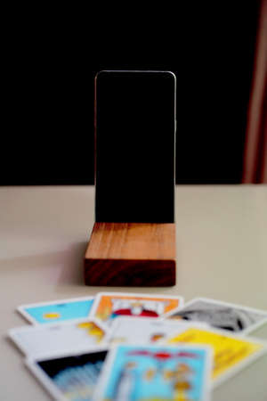 Defocused mystic ritual with tarot cards, and candles.のeditorial素材