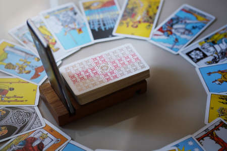 Defocused mystic ritual with tarot cards, and candles.のeditorial素材