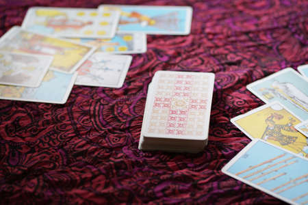 Defocused mystic ritual with tarot cards, and candles.のeditorial素材