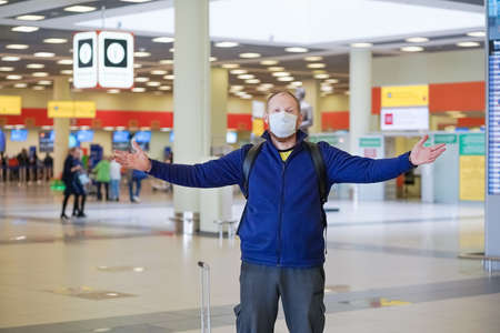 European redbeard man is in protective medical mask in airportのeditorial素材