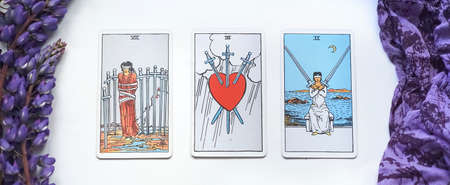 Defocused romantic Tarot Setup Background. Tarot cards and Lupin flowers. High quality photo