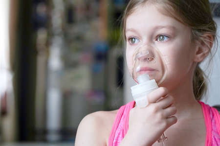 Girl makes inhalation nebulizer at home.