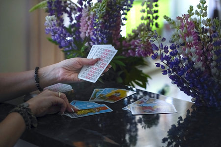 Blurred background of Tarot cards on table. High quality photo