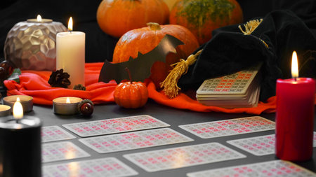 Blurred mystic ritual with tarot cards, and candles. Halloween composition. High quality photoのeditorial素材