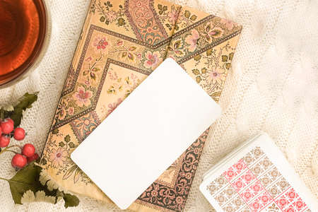Autumn comAutumn composition with cup of tea maple leaves and tarot cards position with cup of tea maple leaves and tarot cards. High quality photoのeditorial素材