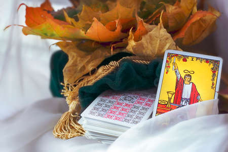Blurred Tarot reading, card magician on the table. Esoteric concept and astrology.のeditorial素材
