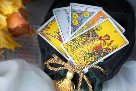 Blurred Tarot reading, card magician on the table. Esoteric concept and astrology.のeditorial素材