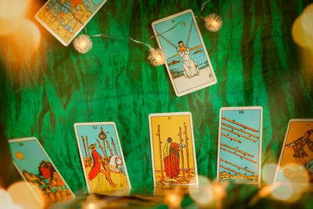 Blurred Green background of winter composition with tarot cards. High quality photo