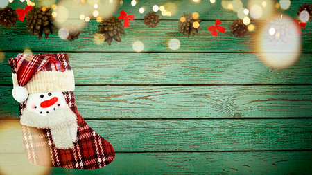 Xmas composition with Christmas stocking on Green background. High quality photo