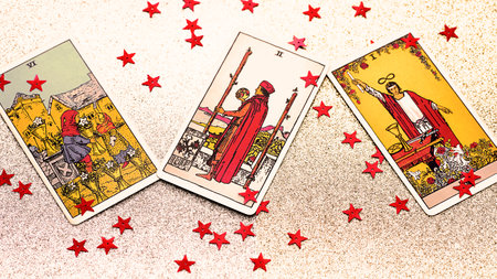 Blurred Christmas concept with Tarot cards, the Magician, six of cups, two of wands. High quality...