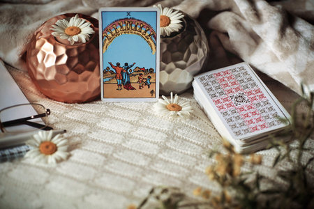 Blurred composition with Tarot cards, candles and flowers. High quality photoのeditorial素材